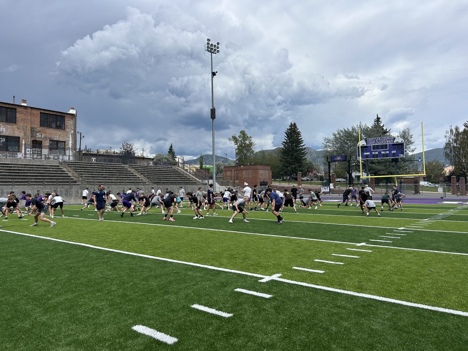 Butte High Bulldogs players lined up for sprints during a Tackle Montana session
